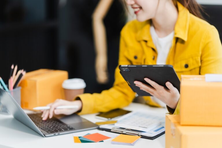 A,Young,Asian,Businesswoman,Efficiently,Manages,Smes,,Utilizing,Her,Desk,